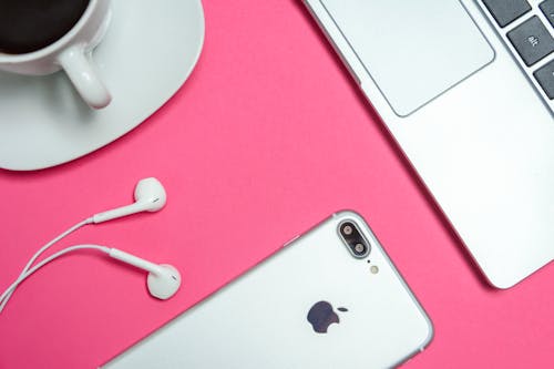 Free Closeup Photo of Silver Iphone 7 Plus With Earpods Stock Photo