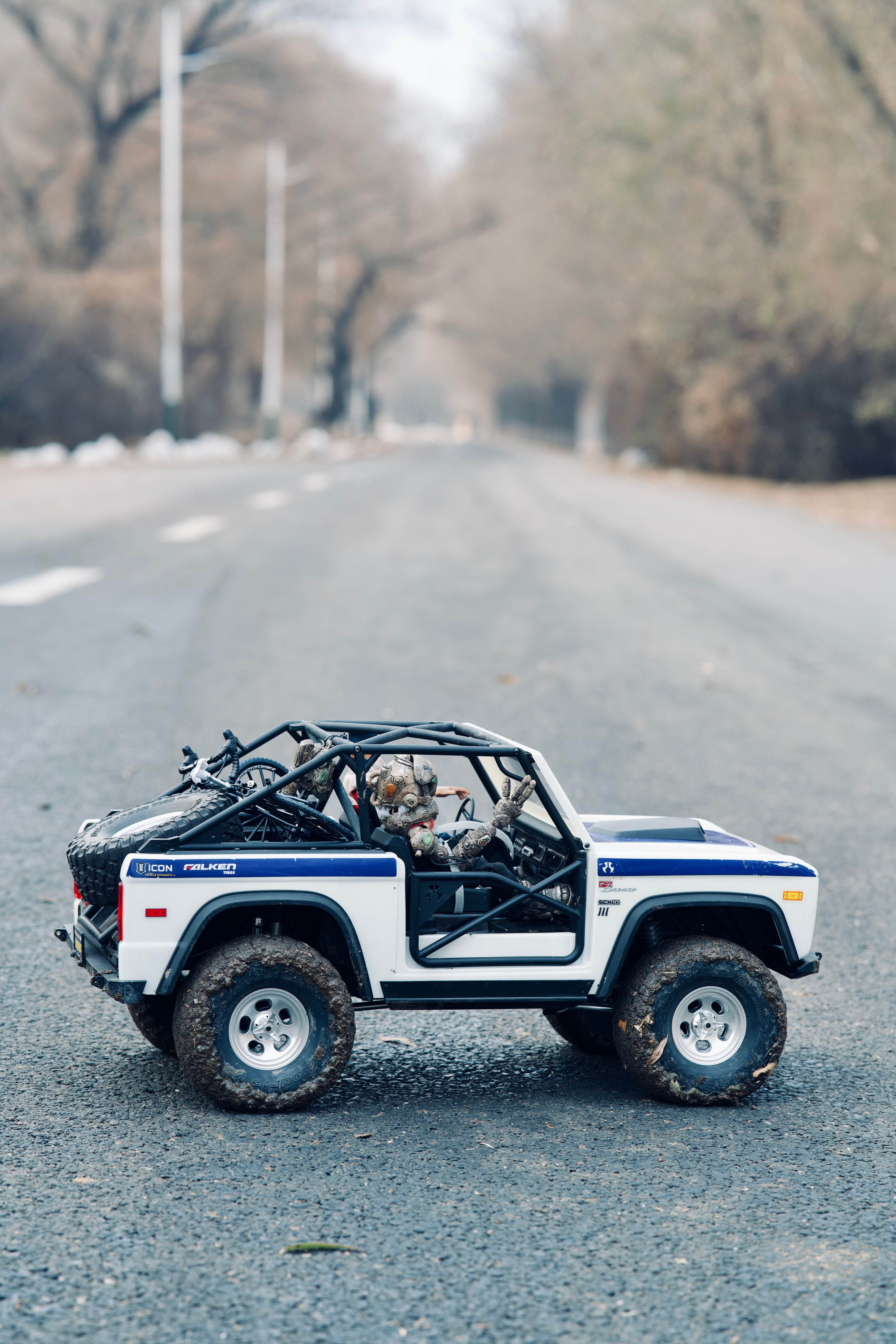 Close Up Shot of an SUV Toy on the Road · Free Stock Photo