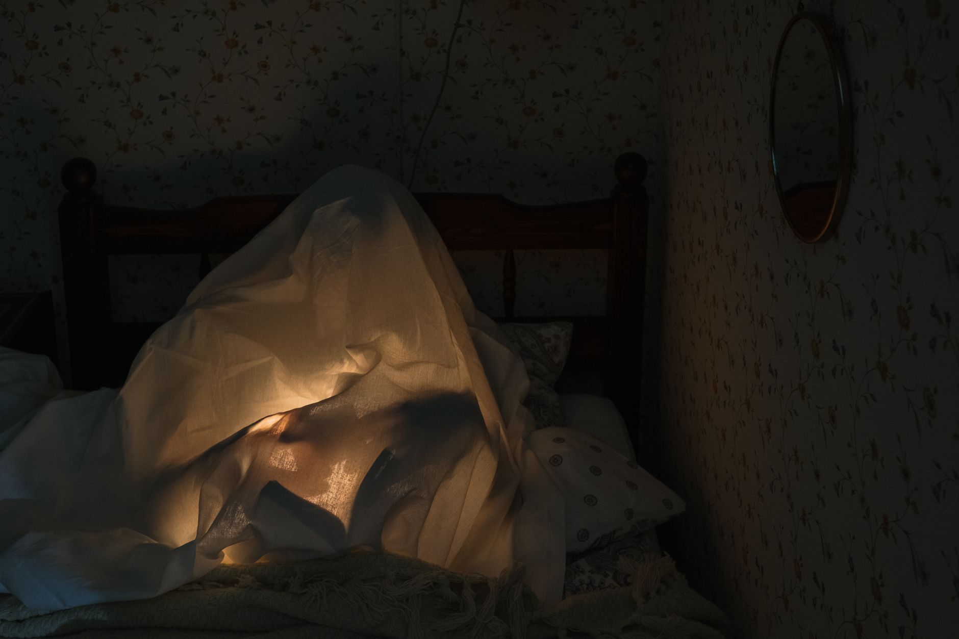 ADHD self-care paralysis focus & productivity adhd — person hiding under cozy blanket bed overwhelmed relatable dim light