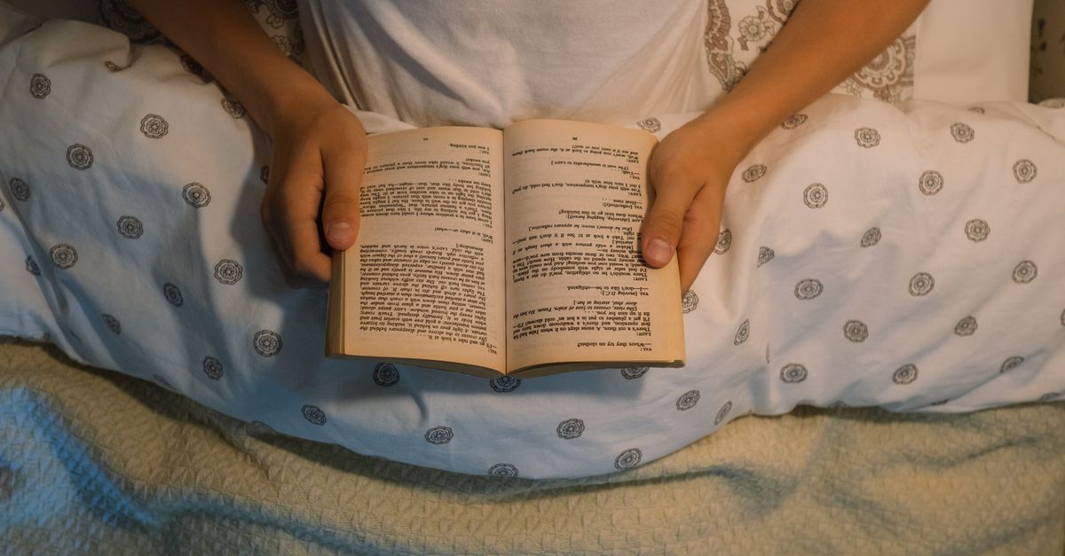 child reading book for pleasure at home instead of worksheets