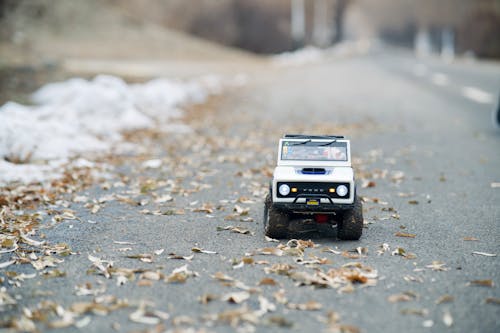 Free Close-Up Shot of a Toy Car on the Road Stock Photo