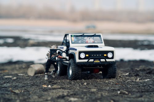 Close-Up Shot of a Toy Car on a Dirt Road