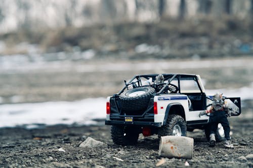 Close-up of a Toy Car on a Beach 