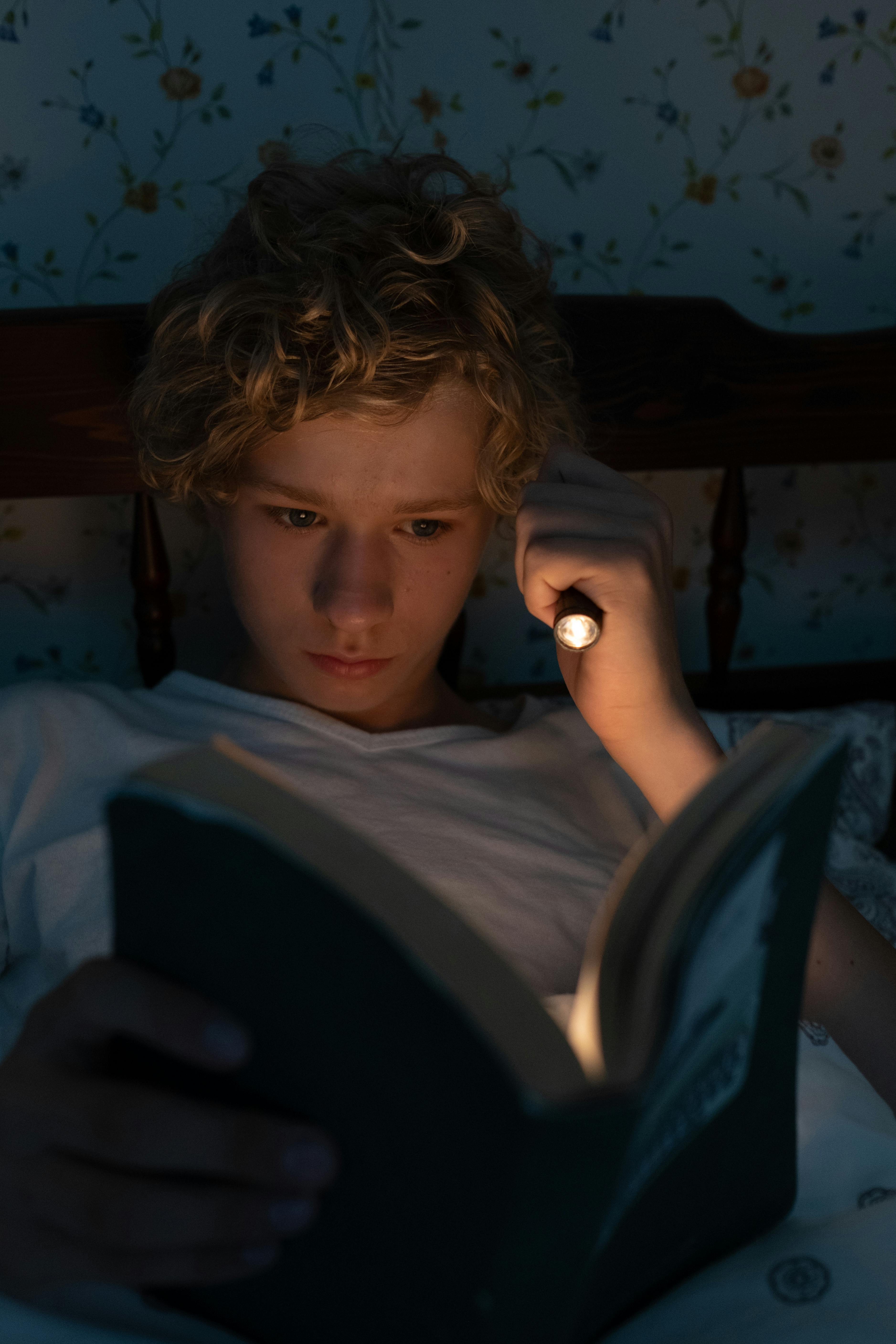 Teenager Reading in Bed at Night · Free Stock Photo