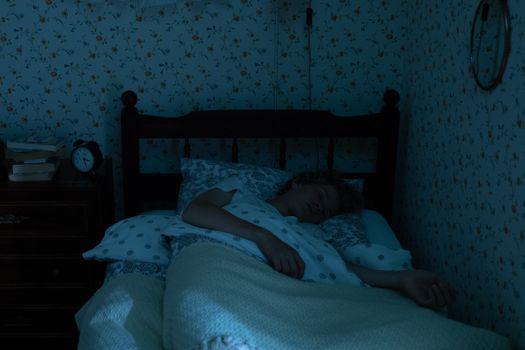 A tranquil image of a teenager sleeping in a vintage bedroom with soft lighting.