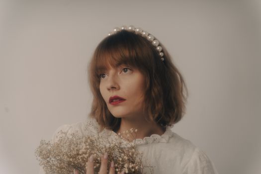 Portrait of a Woman with Bunch of White Flowers
