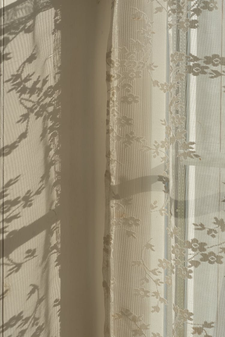 Close-up View Of Curtains With Floral Theme