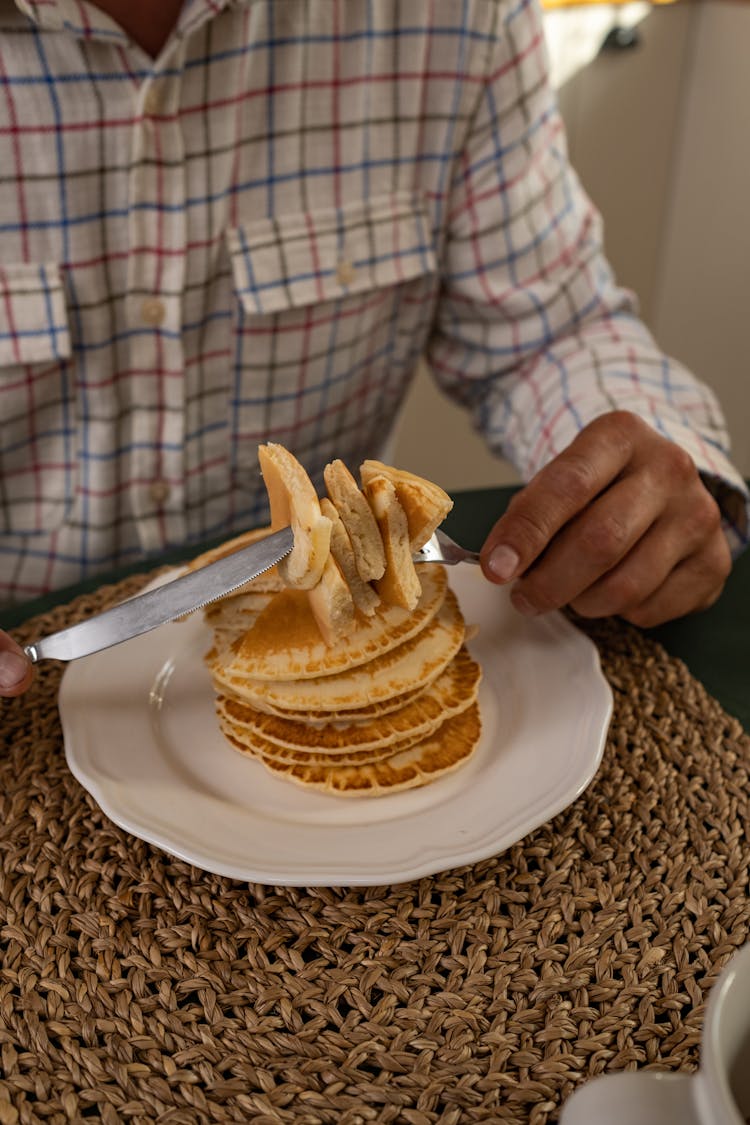 Close-up View Of Man In Shirt Eating Pancakes