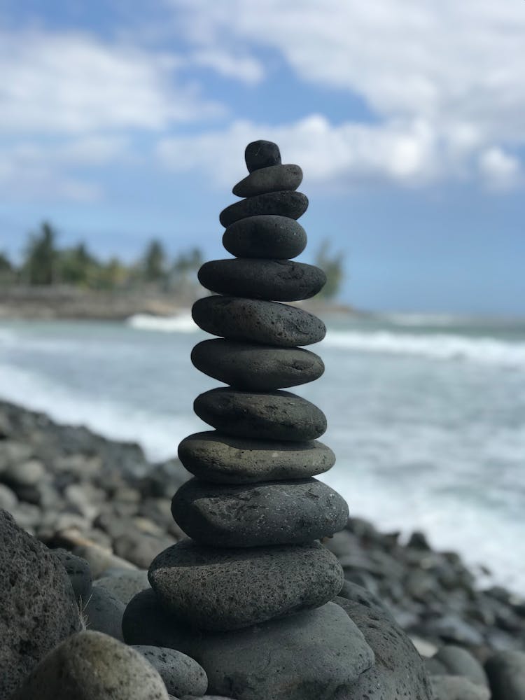 Stack Of Oval Rocks On Beach