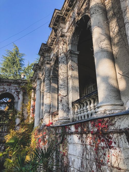 Free Explore the beauty of a historic abandoned building in Adler, Russia, featuring stone pillars and overgrown vines. Stock Photo