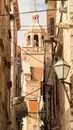 Church Tower between Old Buildings