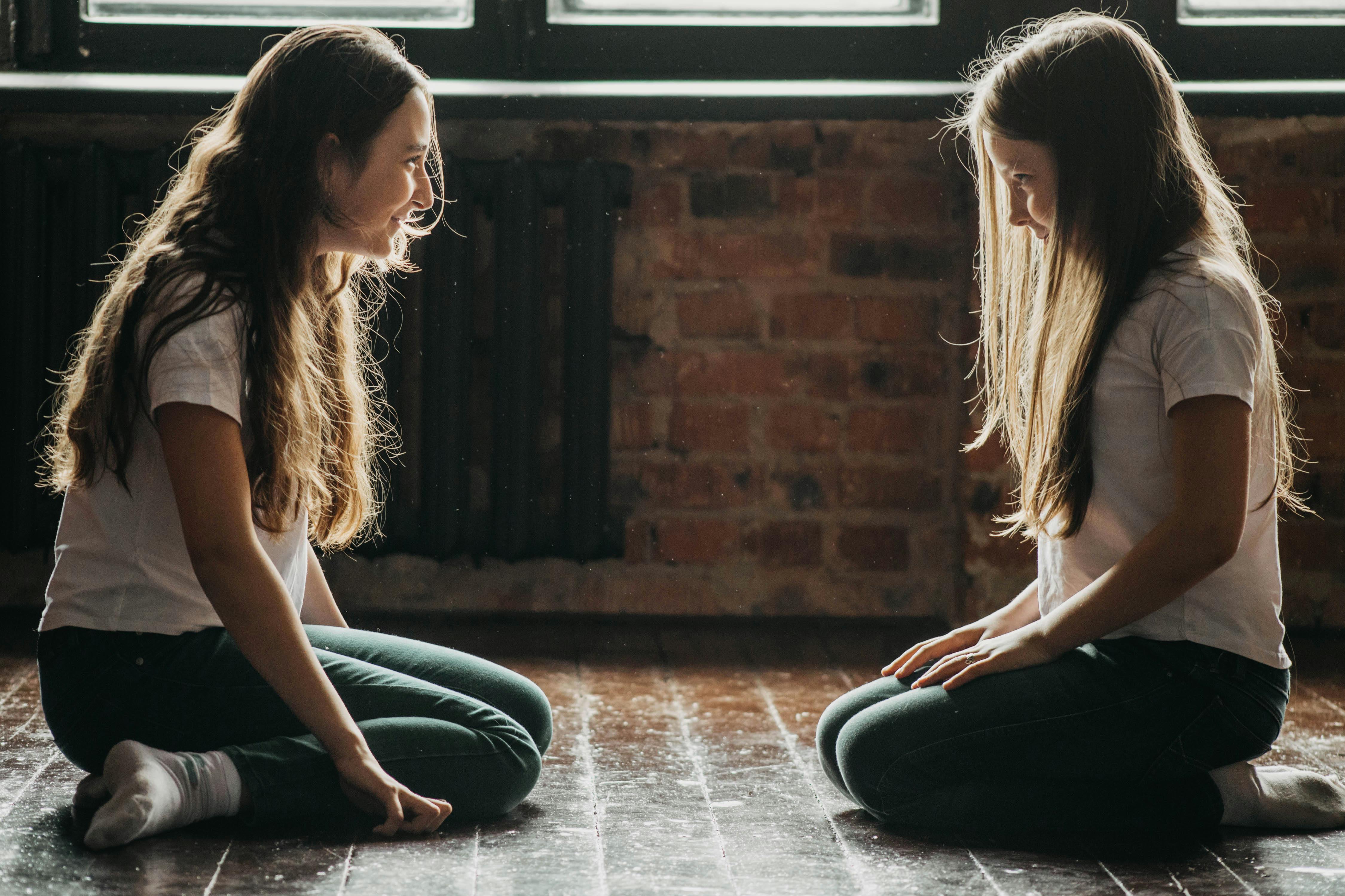 Two Teenage Girls Kneeling On Floor Smiling And Looking At Each Other   Pexels Photo 10389926 