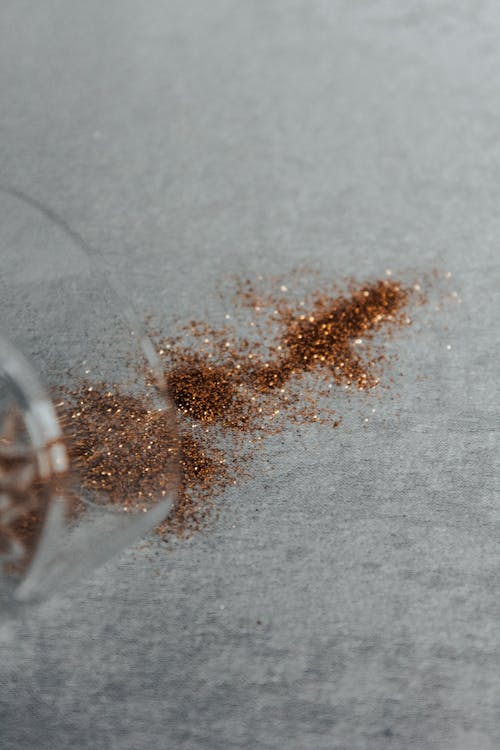Brown Glitter on White Surface