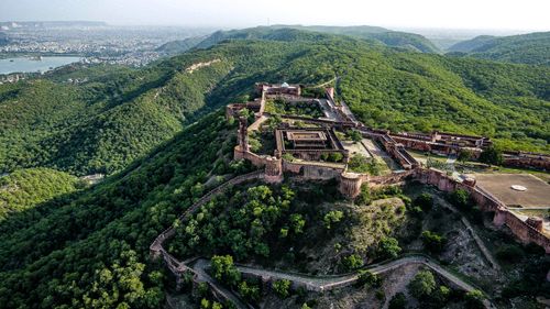 Free Stunning birds-eye view of Amagarh Fort surrounded by lush green hills in Jaipur. Stock Photo