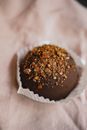 Appetizing Chocolate Ball Sprinkled with Caramel in Cupcake Paper Cup