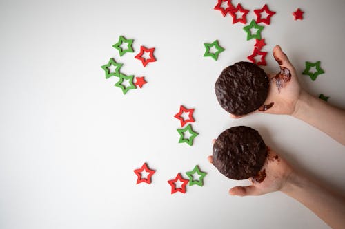 Person Holding Chocolate Cookies