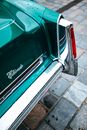 Tail light of a Green Cadillac