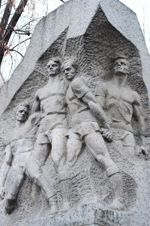 Sculpture of Men on Stone