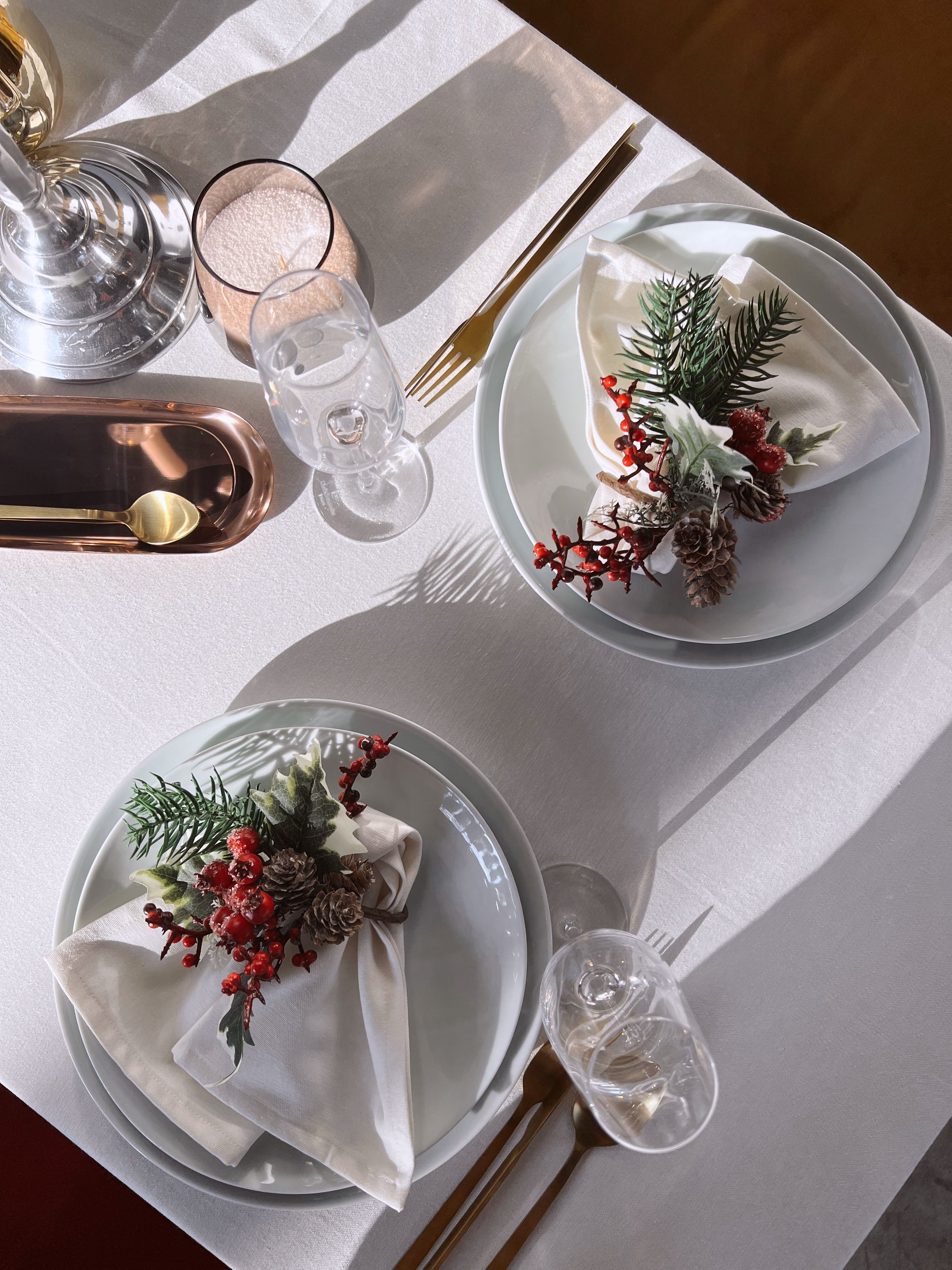 Set Table with Napkins Decorated with Bunch of Pine Twig and Cones ...