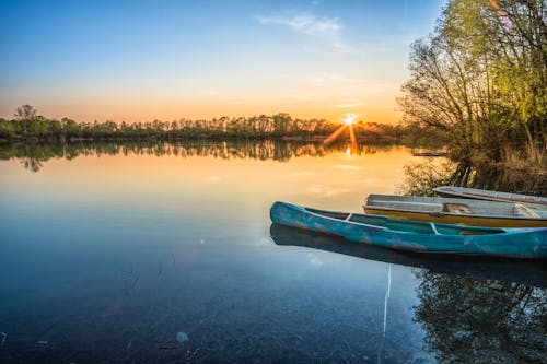 Free Blue Canoe and Body of Water Stock Photo