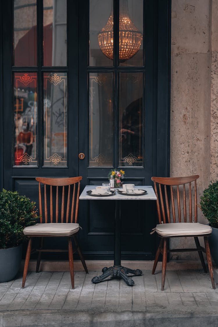 Chairs And A Table Blocking A Door