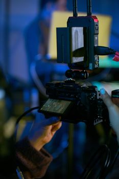 Close-up of video camera setup during a professional video shoot indoors.