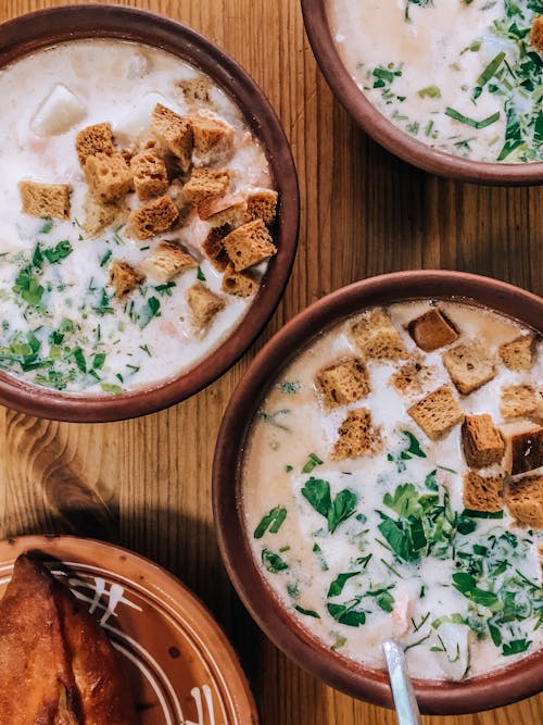 Flatlay of Yummy Soups in Bowls