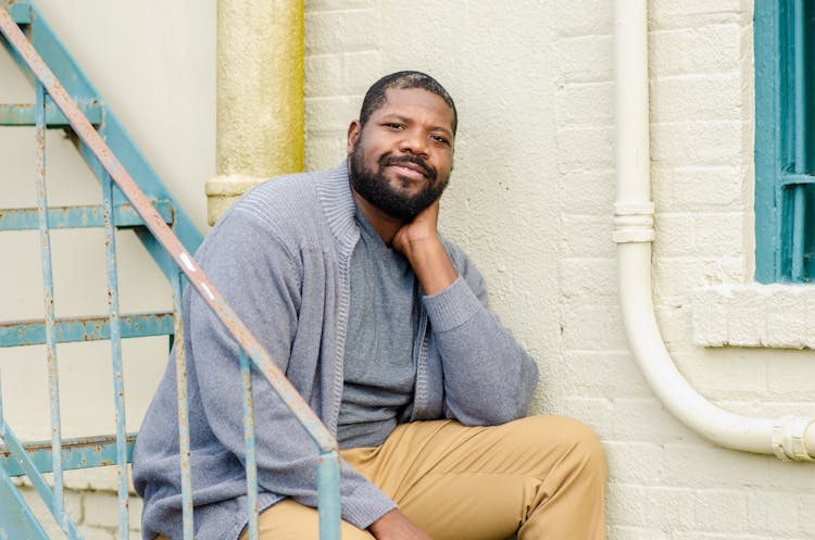 Man Posing On Fire Stairs