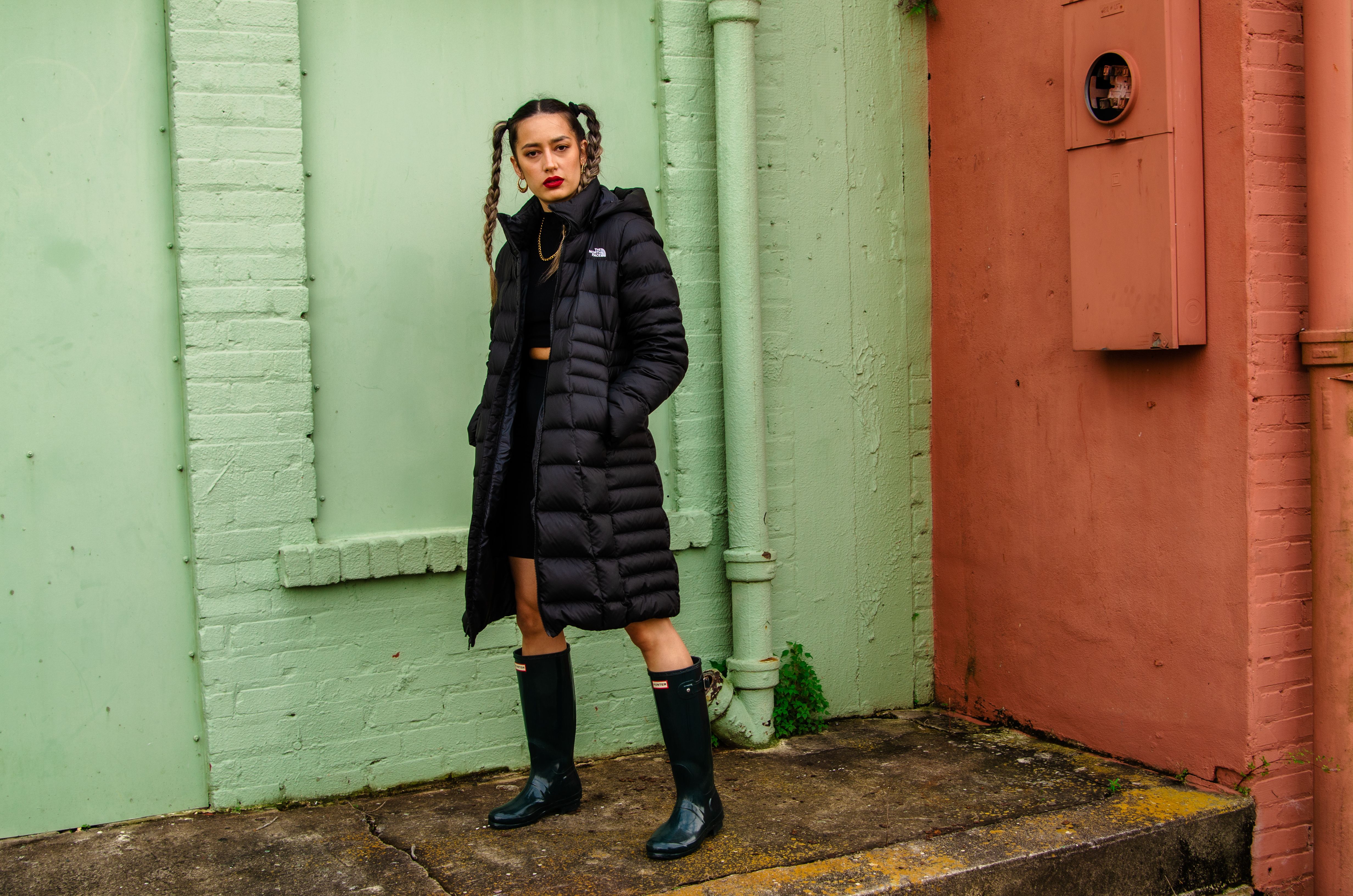 A Woman Wearing Black Jacket and Black Boots · Free Stock Photo