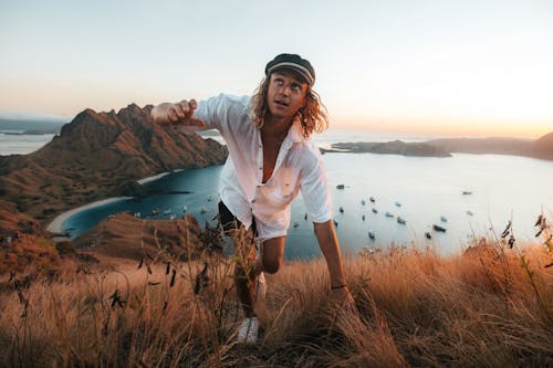 Man Climbing on Hill