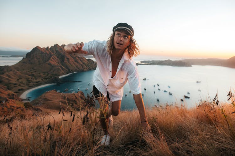 Man Climbing On Hill