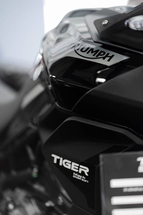Close-Up Shot of a Black Triumph Tiger Motorcycle
