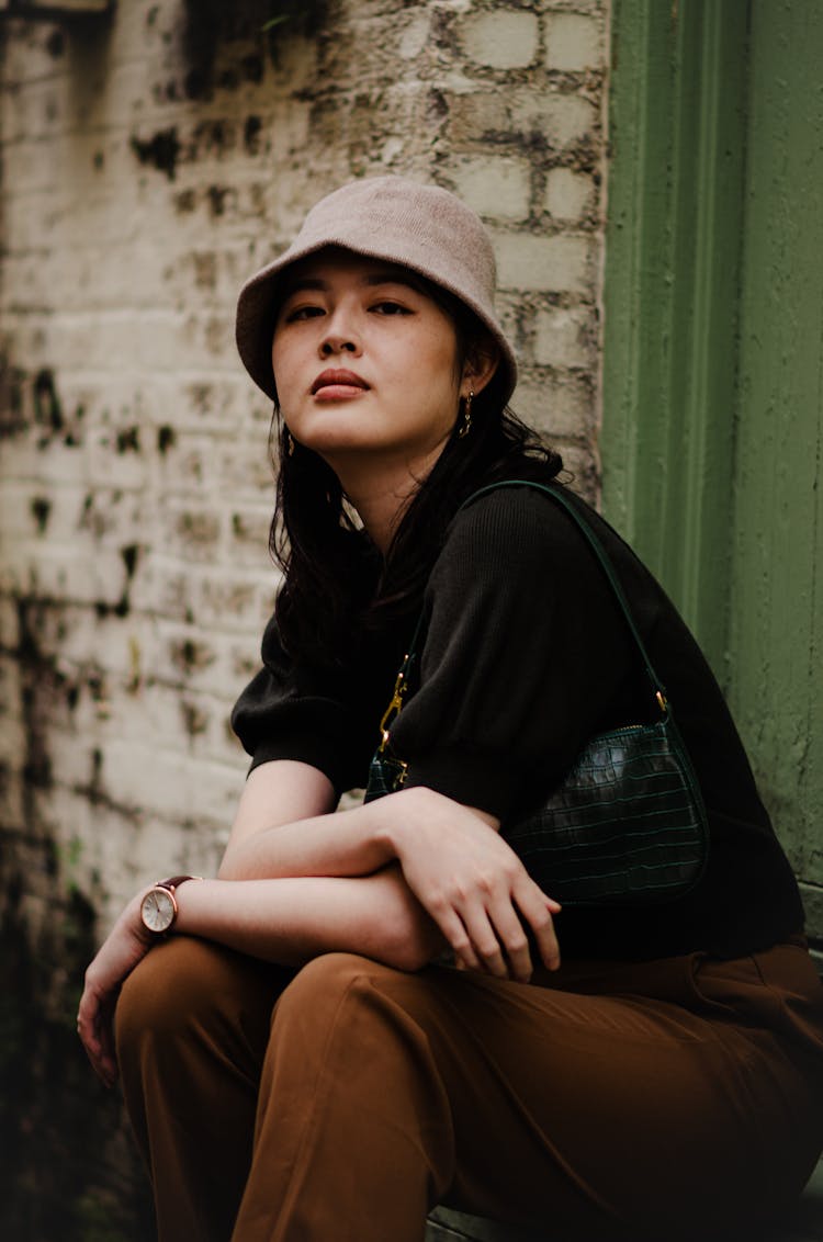 Portrait Of Woman Sitting On Doorstep