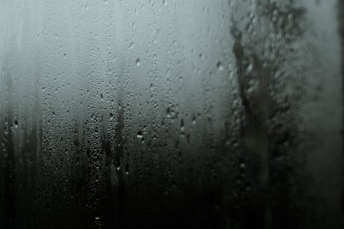 Free Water Droplets on Glass Window Stock Photo