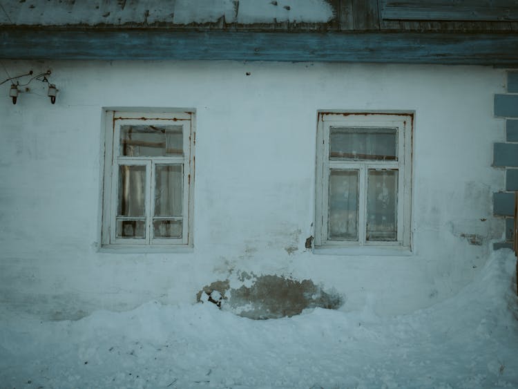 White Wooden Framed Glass Windows Of A House