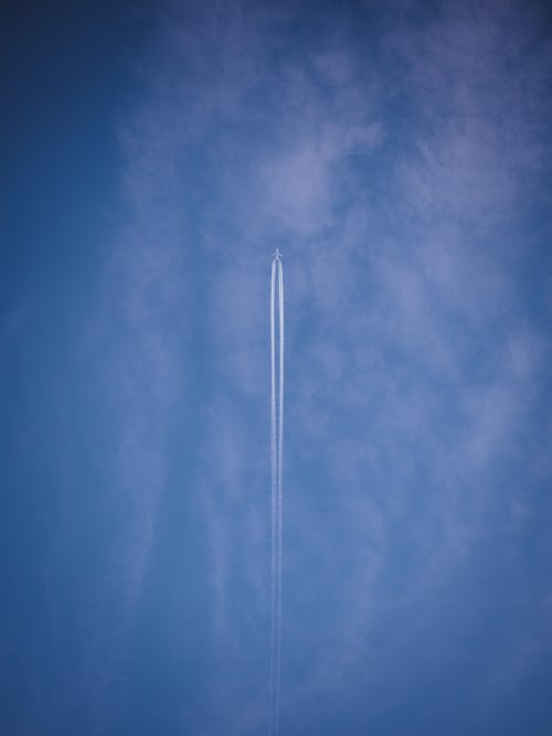 Contrail of an Airplane on Blue Sky