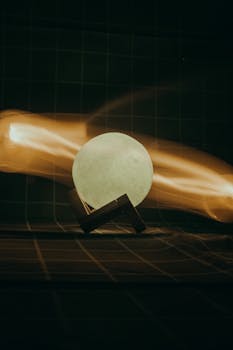 Captivating abstract image featuring a glowing sphere with dynamic light trails.