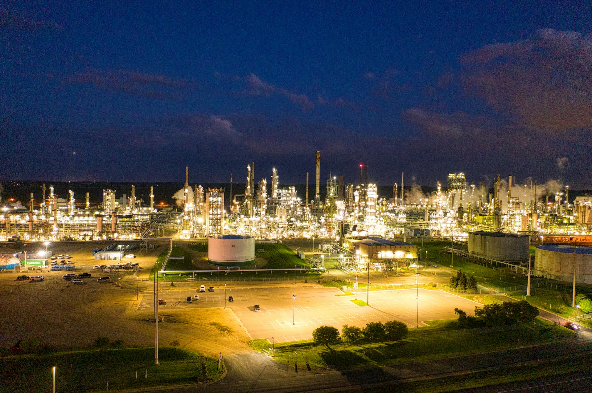 A stunning aerial shot of an illuminated oil refinery at night showcasing industrial production in Rosemount, MN.