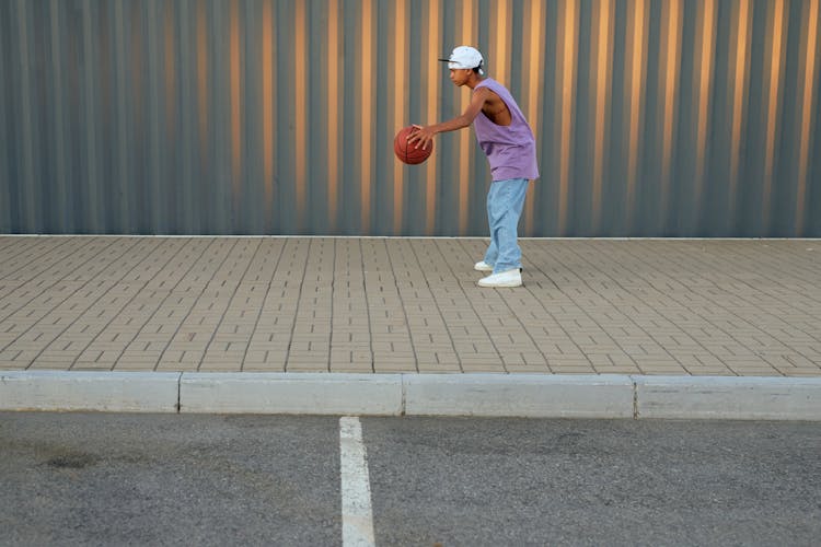 A Boy Holding A Ball