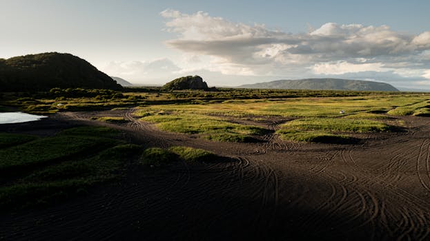 Expansive view of Kamchatka with hills and a dramatic sky, perfect tranquility.