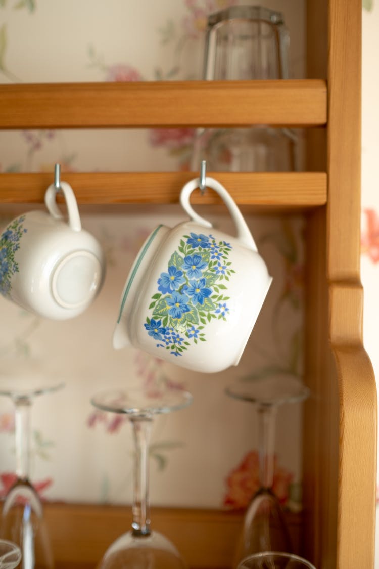 Close-up Of Vintage Milk Jug Hanging Oh Shelf