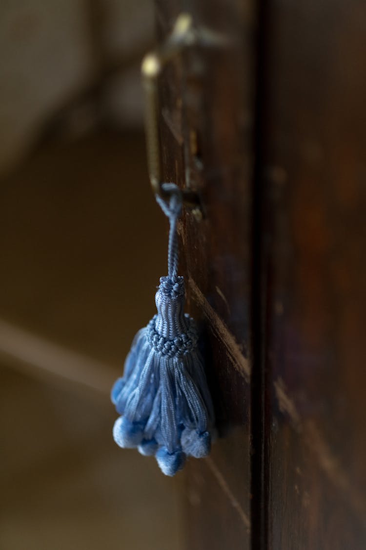 Close-up Of Blue Tassel Hanging On Door