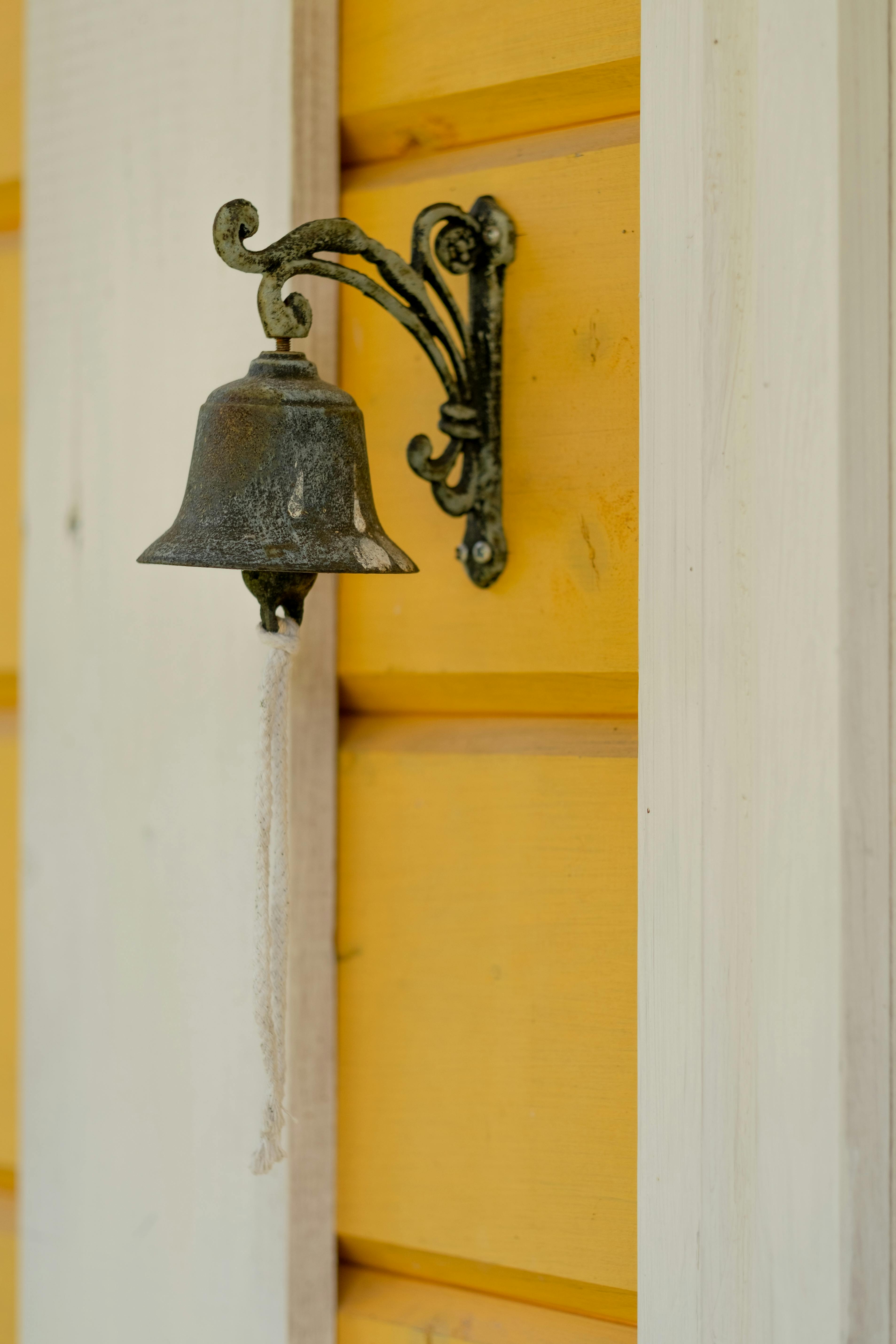 Free Vintage Doorbell on Yellow Wall Stock Photo