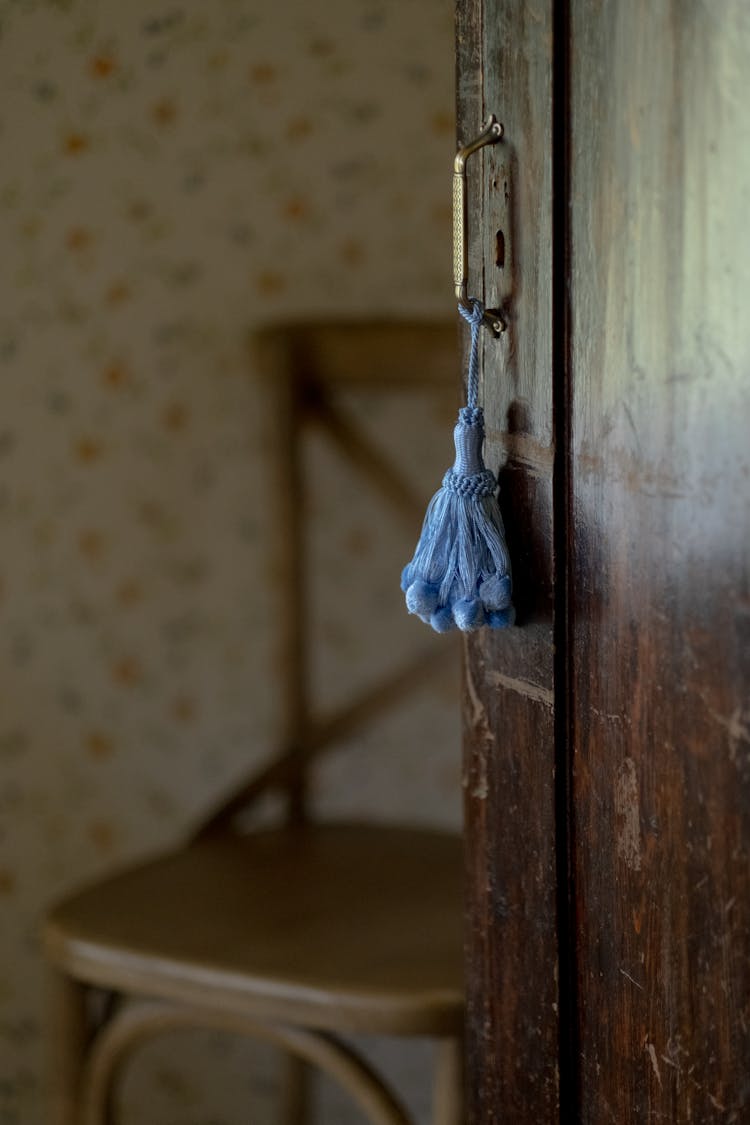 Close-up of Blue Tassel Hanging On Door