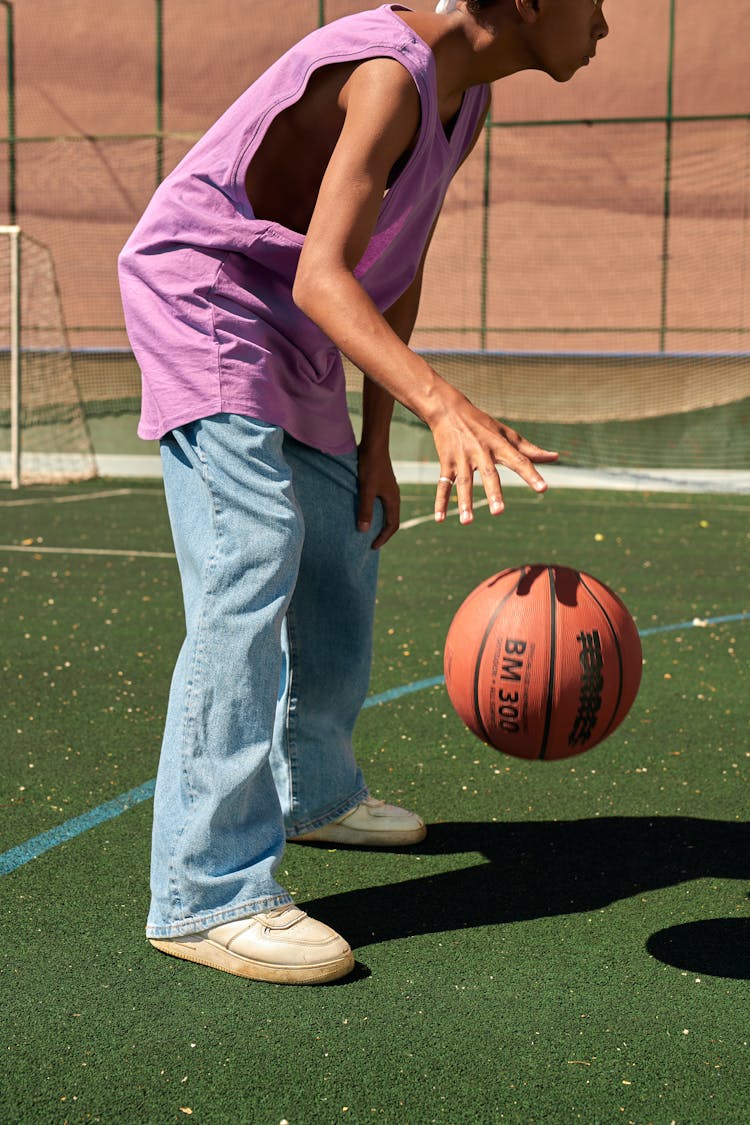 A Boy Dribbling A Ball