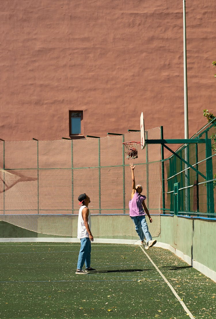 Two Men Playing Basketball