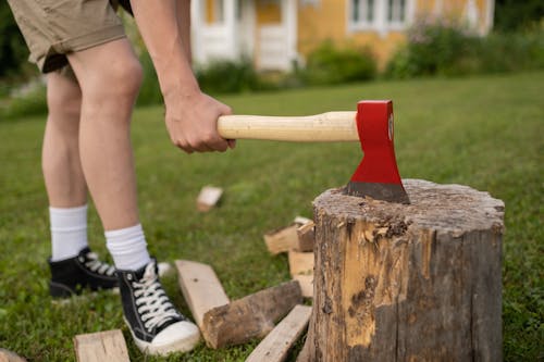Boy Chopping Wood with Axe