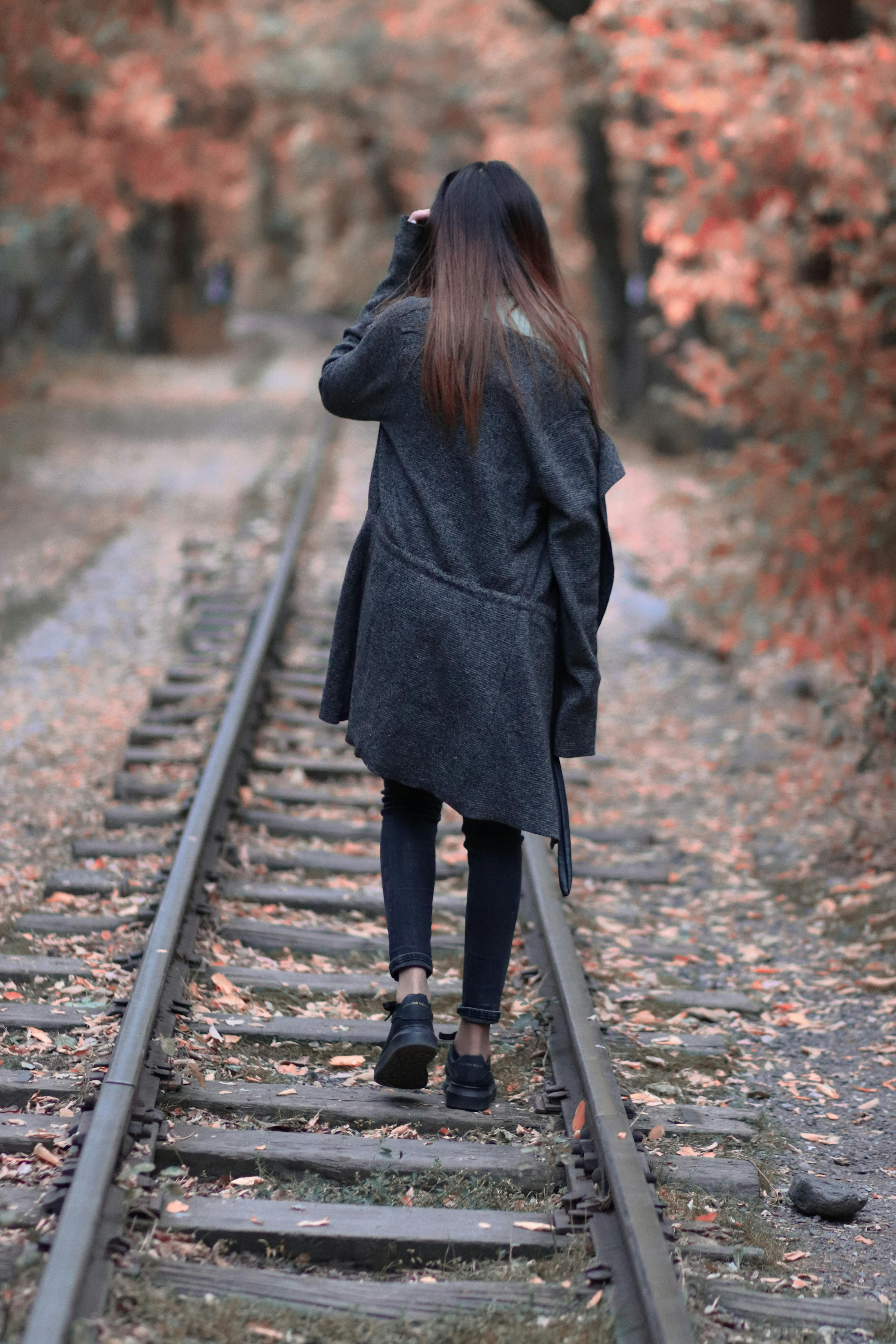 Back View of a Woman Wearing White Fur Coat · Free Stock Photo