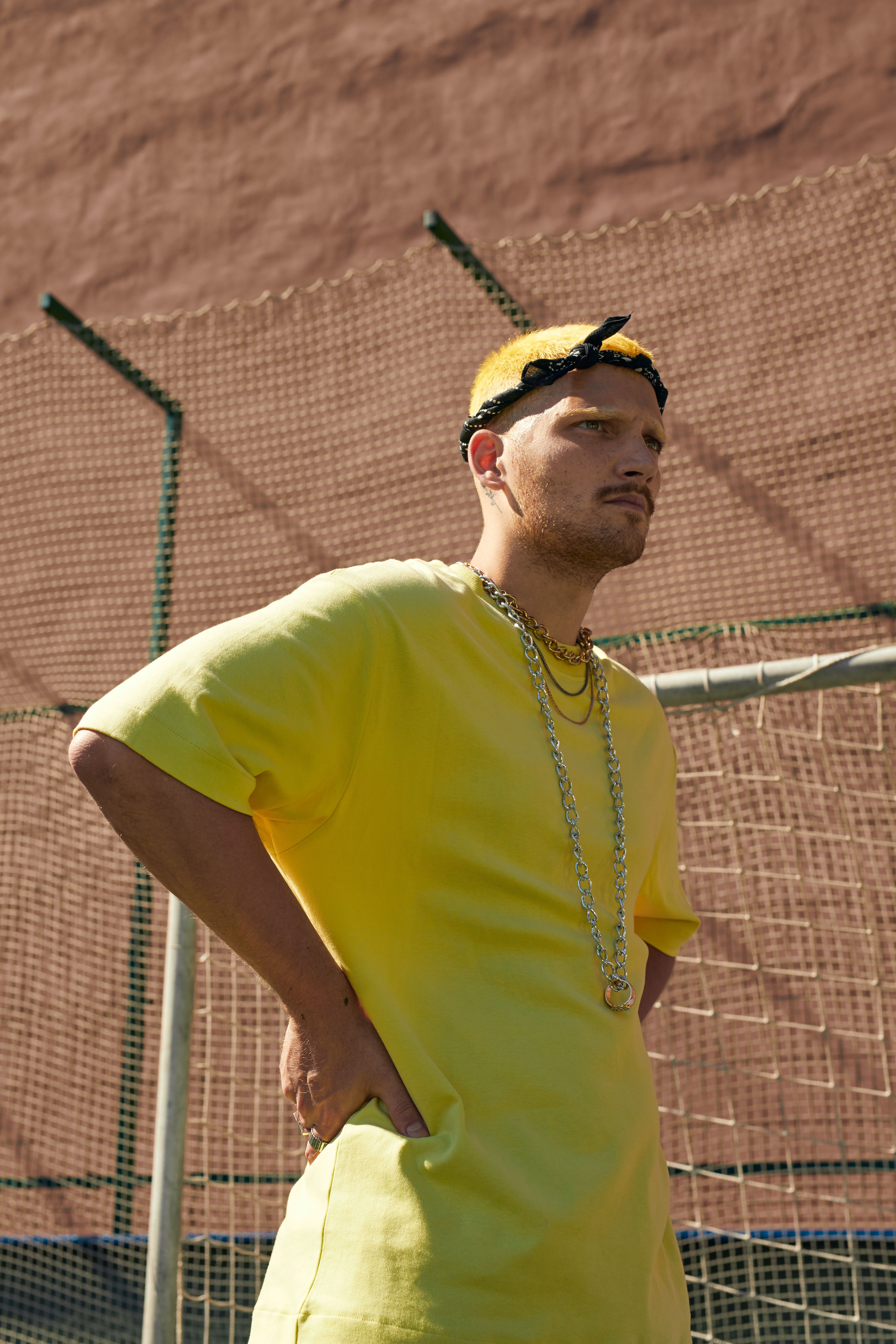 Man in Yellow Shirt with His Hands on His Waist · Free Stock Photo