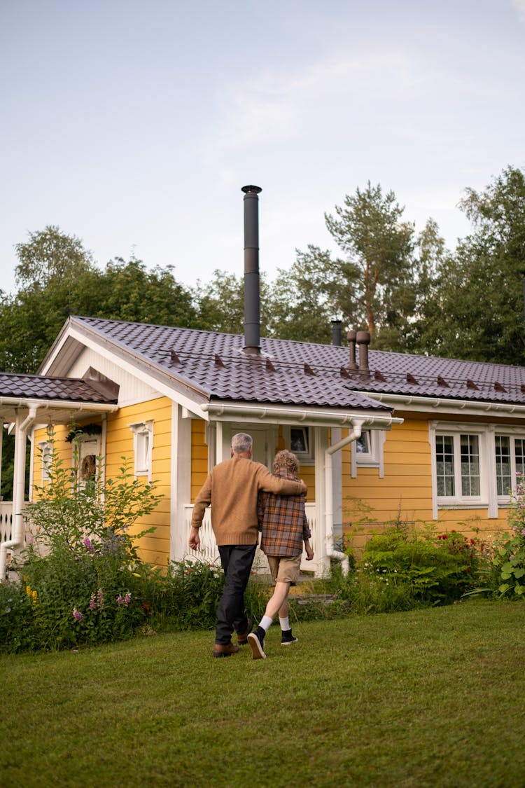 Grandfather And Grandson Walking Home